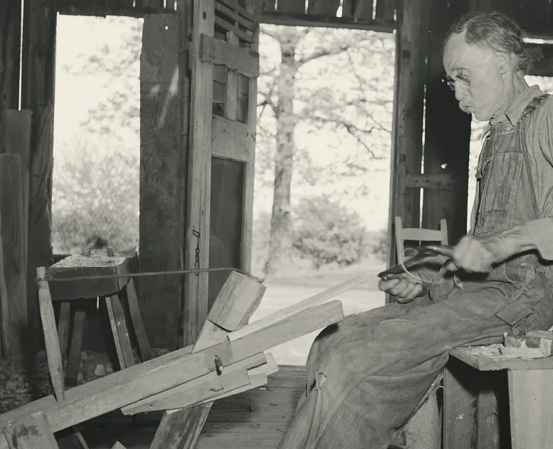 William Stamper, 82, shaving oak sticks in his workshop